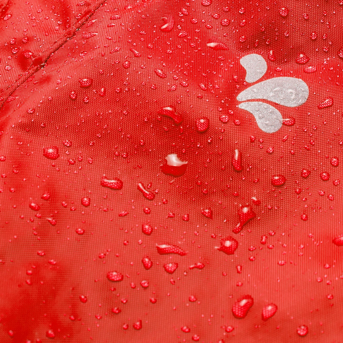 Close-up of the red Originals Waterproof Trousers with water droplets, showcasing the waterproof material and small white logo.