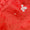 Close-up of the red Originals Waterproof Trousers with water droplets, showcasing the waterproof material and small white logo.