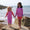 Muddy Puddlers!: Two young girls stand on a beach rock, holding hands and smiling. They're wearing star-print swimwear in pink and red.