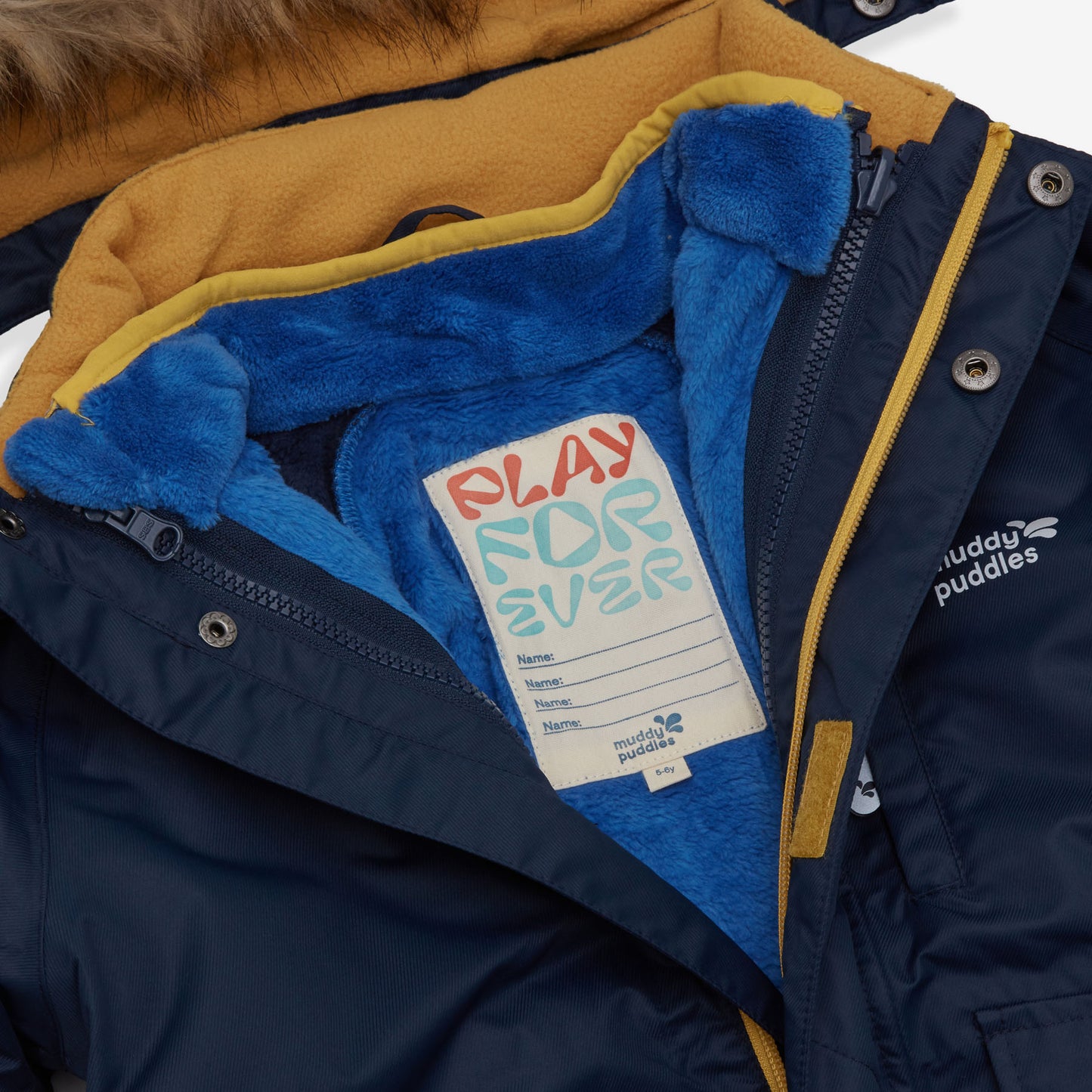 A navy 3 in 1 Waterproof Parka, showing the inner blue fleece and a name tag reading "Play Forever".