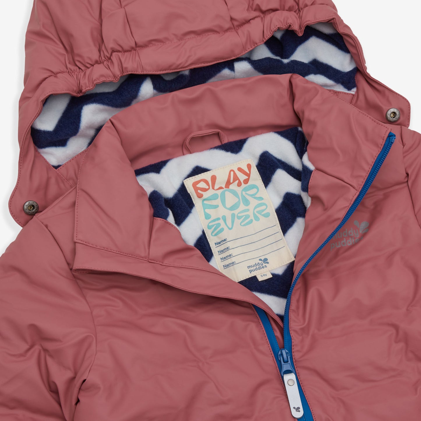 A close up of the Waterproof Puffer Jacket in pink, showing the label and the zigzag pattern of the hood lining.