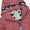 A close up of the Waterproof Puffer Jacket in pink, showing the label and the zigzag pattern of the hood lining.