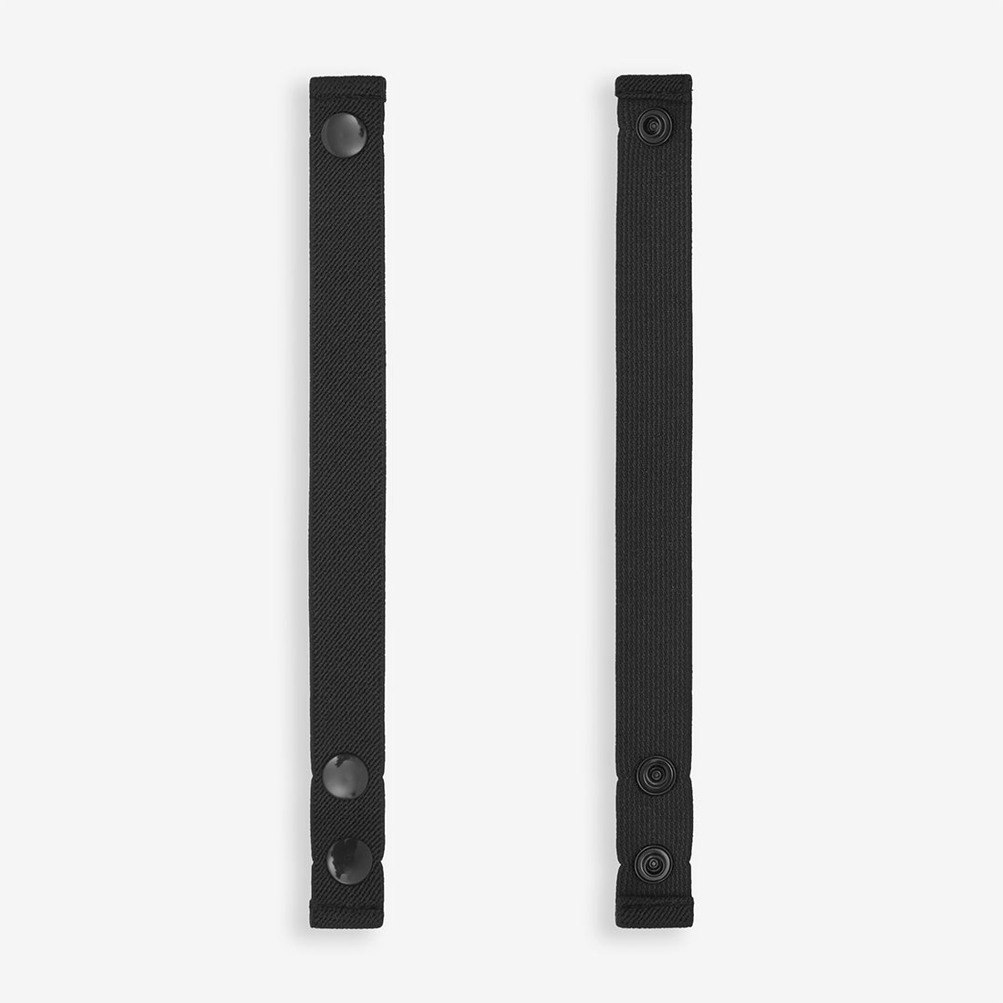 Spare Single Stirrup Black Plastic Poppers, two black straps are aligned vertically, each with plastic poppers at either end.