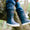 Navy Puddleflex Fleece Lined Wellies being worn whilst sat on a tree branch, close up shot.