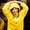 A young girl in a Rainy Day Waterproof Jacket Yellow smiles, holding her hands above her hooded head in a playful manner.