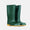 A pair of green 'Classic Wellies' stand on a white surface, their bright orange soles providing a vibrant contrast.