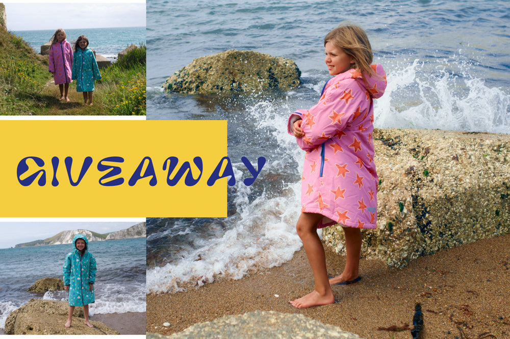 Children in colorful waterproof robes playing by the seaside, waterproof kids' outerwear