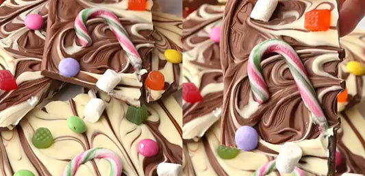Festive chocolate bark with candy canes, marshmallows, and colorful sweets