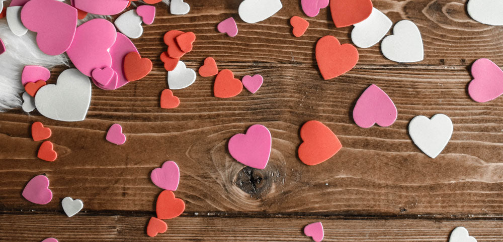 foam hearts for crafting, on a wooden background