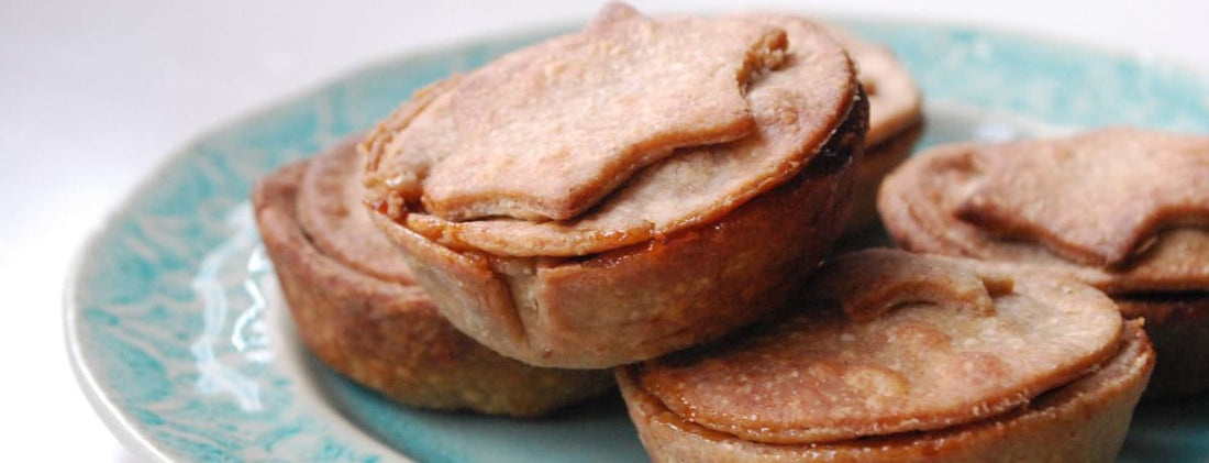 homemade mince pies on a aqua patterned plate