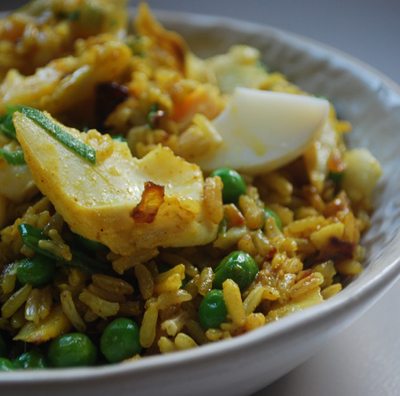 close up of kedergeree in a white bowl