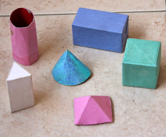 cardboard shapes painted in a variety of colours