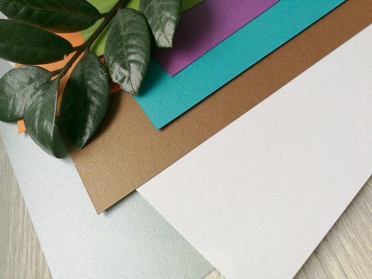 close up of coloured paper and leaves