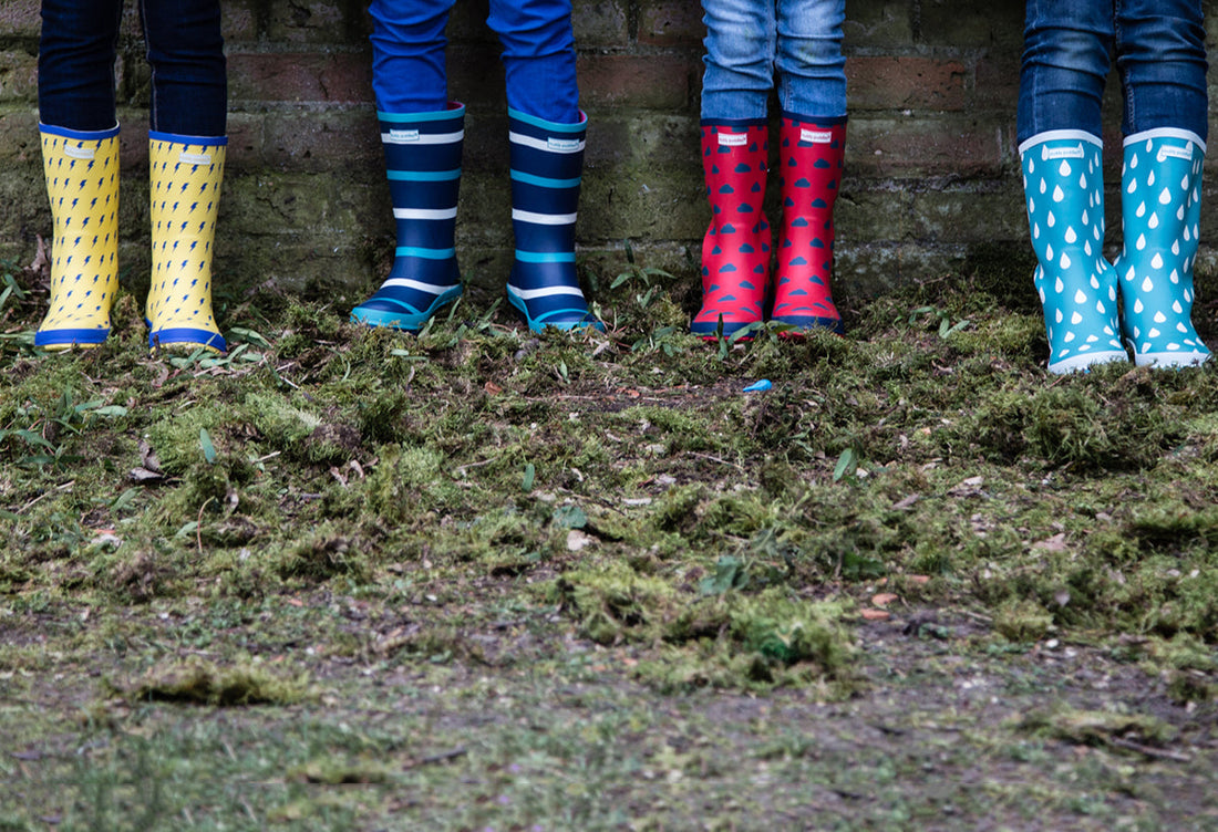 close up of children wearing colourful patterned wellies