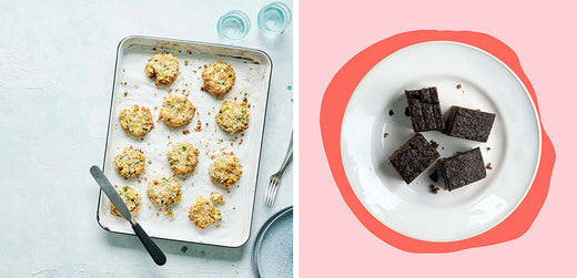 Tray of baked savory biscuits and plate with four chocolate brownies, overhead view