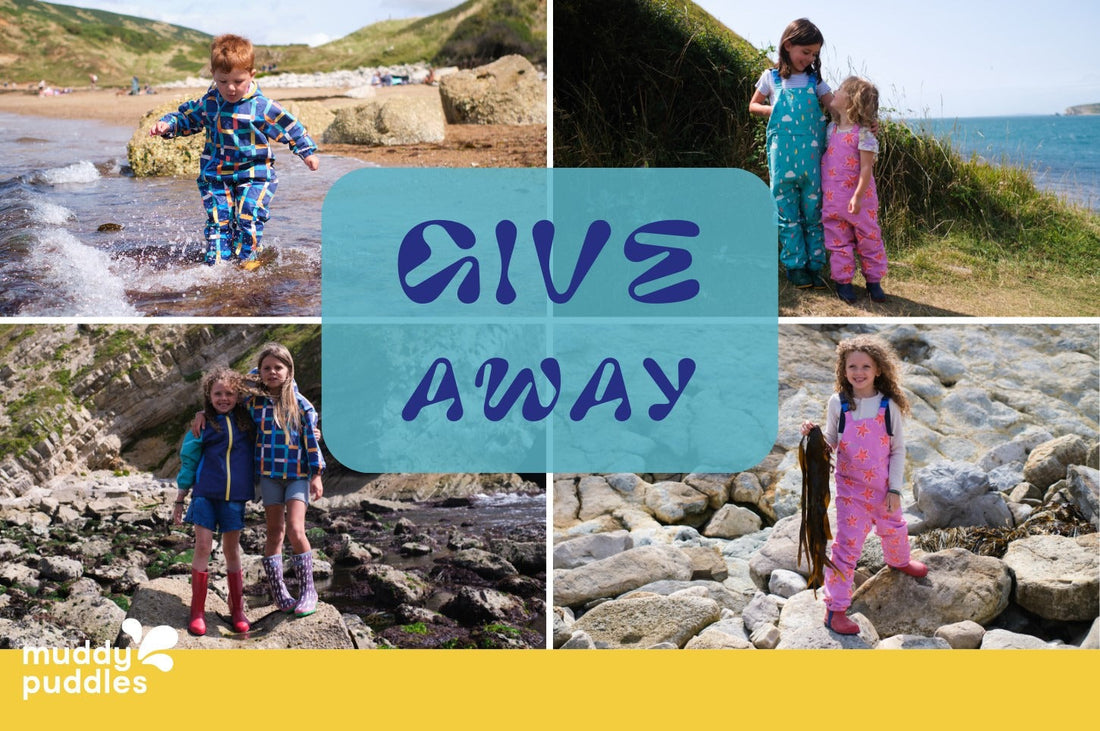 Children wearing colorful waterproofs outdoors by sea and rocks, text reads 'Give Away'