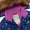 Waterproof Parka Blue Leopard: A children's winter jacket by Muddy Puddles, featuring blue abstract and star patterns, plush purple fleece lining, and faux-fur hood trim. Durable and cozy design.