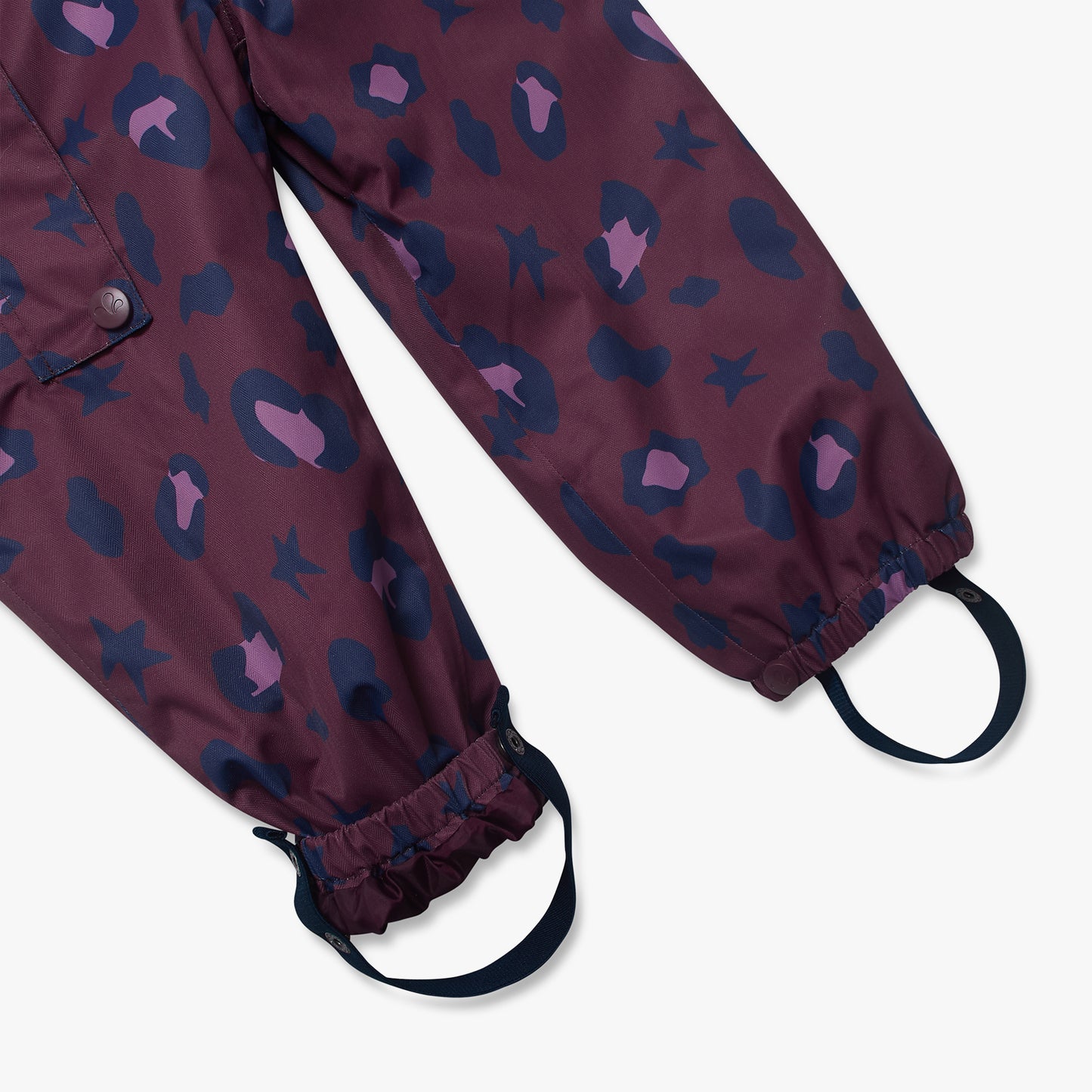 3 in 1 Waterproof Scampsuit Burgundy Animal features durable, waterproof snow pants with elasticized cuffs, navy stirrup straps, and a playful leopard-spot and star print.
