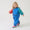 Toddler wearing the EcoLight Lightweight Waterproof Puddle Suit Blue Colourblock, exploring in colorful rain boots; durable, waterproof design ideal for active play in wet weather.