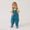 Toddler wearing EcoLight Waterproof Dungarees Green Snake, enjoying bubbles. Features include durable, fluorine-free waterproof fabric, adjustable fit, and playful snake-themed print.
