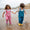 Children in EcoLight Waterproof Dungarees Pink Weather wade through seawater, showcasing durable, waterproof protection with adjustable straps and eco-friendly design from Muddy Puddles.