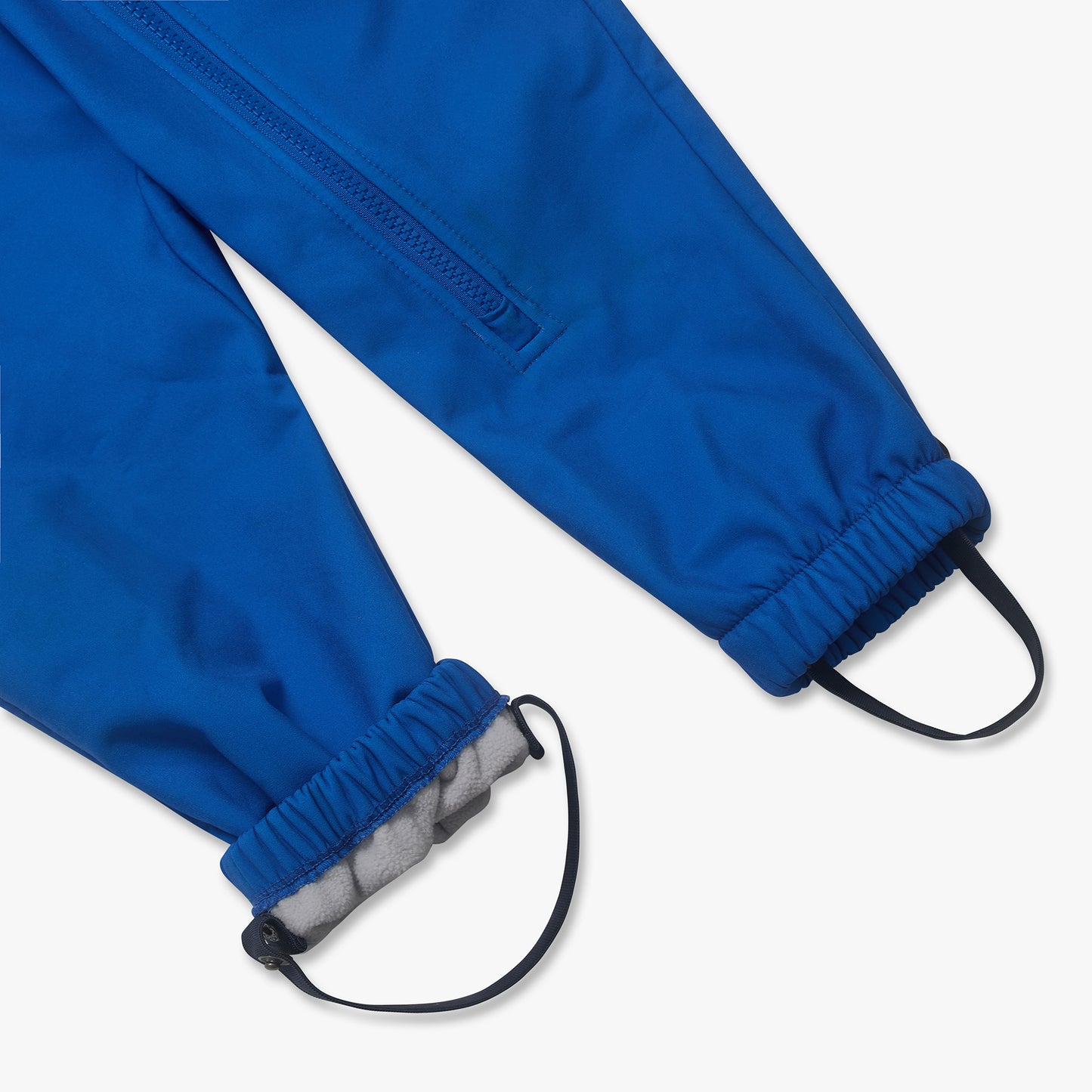 Waterproof Softshell Puddle Suit Blue features elastic cuffs, under-foot stirrups, and a zippered pocket, with visible fleece lining for durable, weather-resistant adventures.