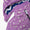 Waterproof Puffer Jacket Lilac Floral, featuring a floral-print design, detachable hood with snap fasteners, zip-front closure, and blue-and-white zigzag fleece lining for added warmth.